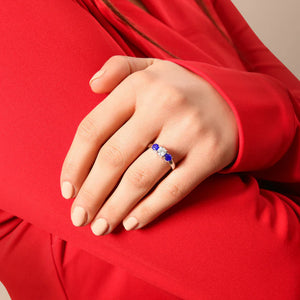 Round Diamond and Blue Sapphire Three-Stone Ring in 14K White Gold