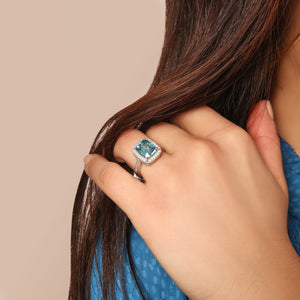 Radiant Cut Blue Zircon and Diamond Halo Ring in 18kt White Gold