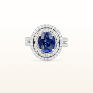 5.30 ctw Oval Blue Sapphire and Diamond Scalloped Halo in 18kt White Gold