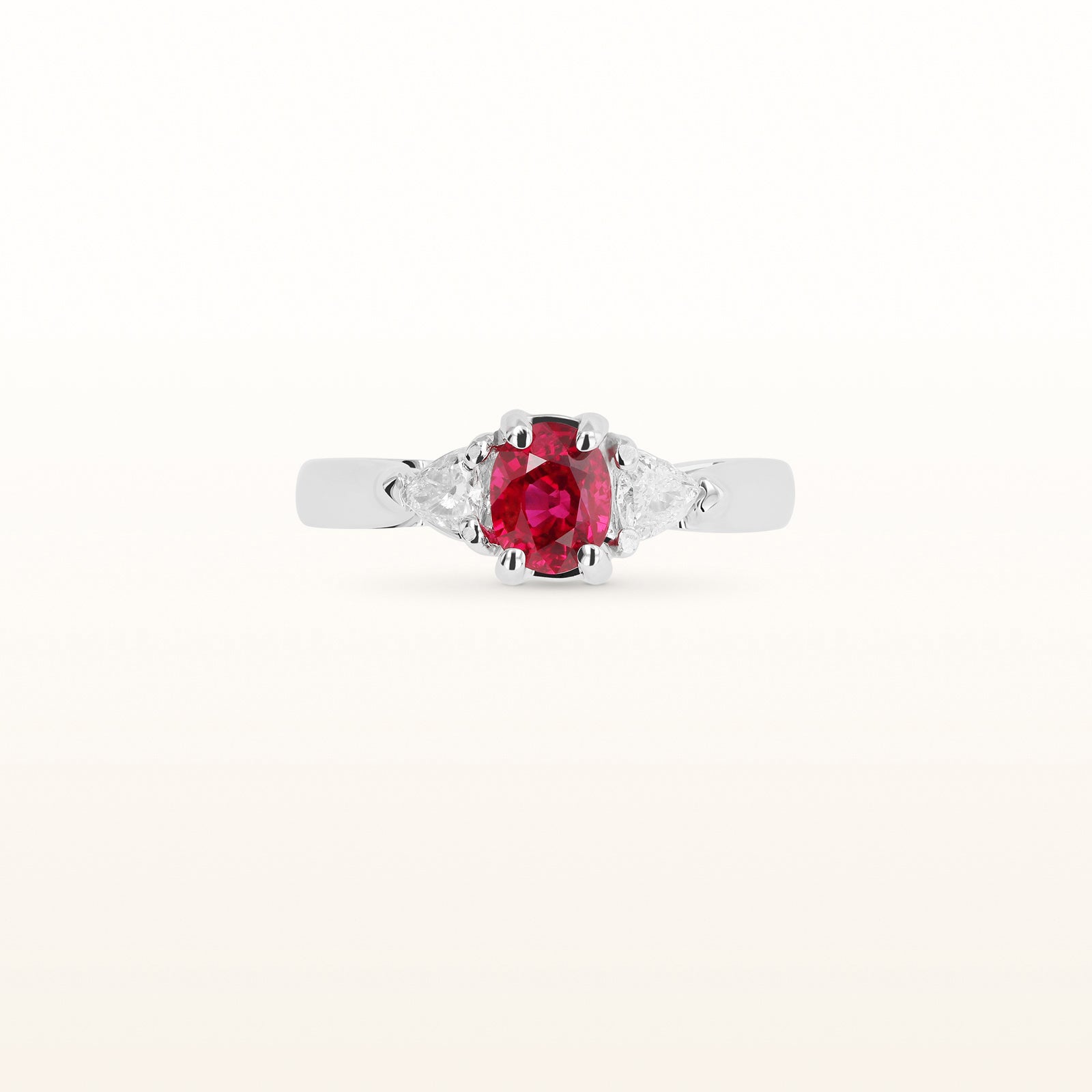 1.25 ctw Oval Ruby and Trillion Diamond Three-Stone Ring in 14kt White Gold