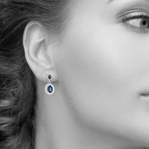 Oval Blue Sapphire and Diamond Halo Drop Earrings in 14kt White Gold